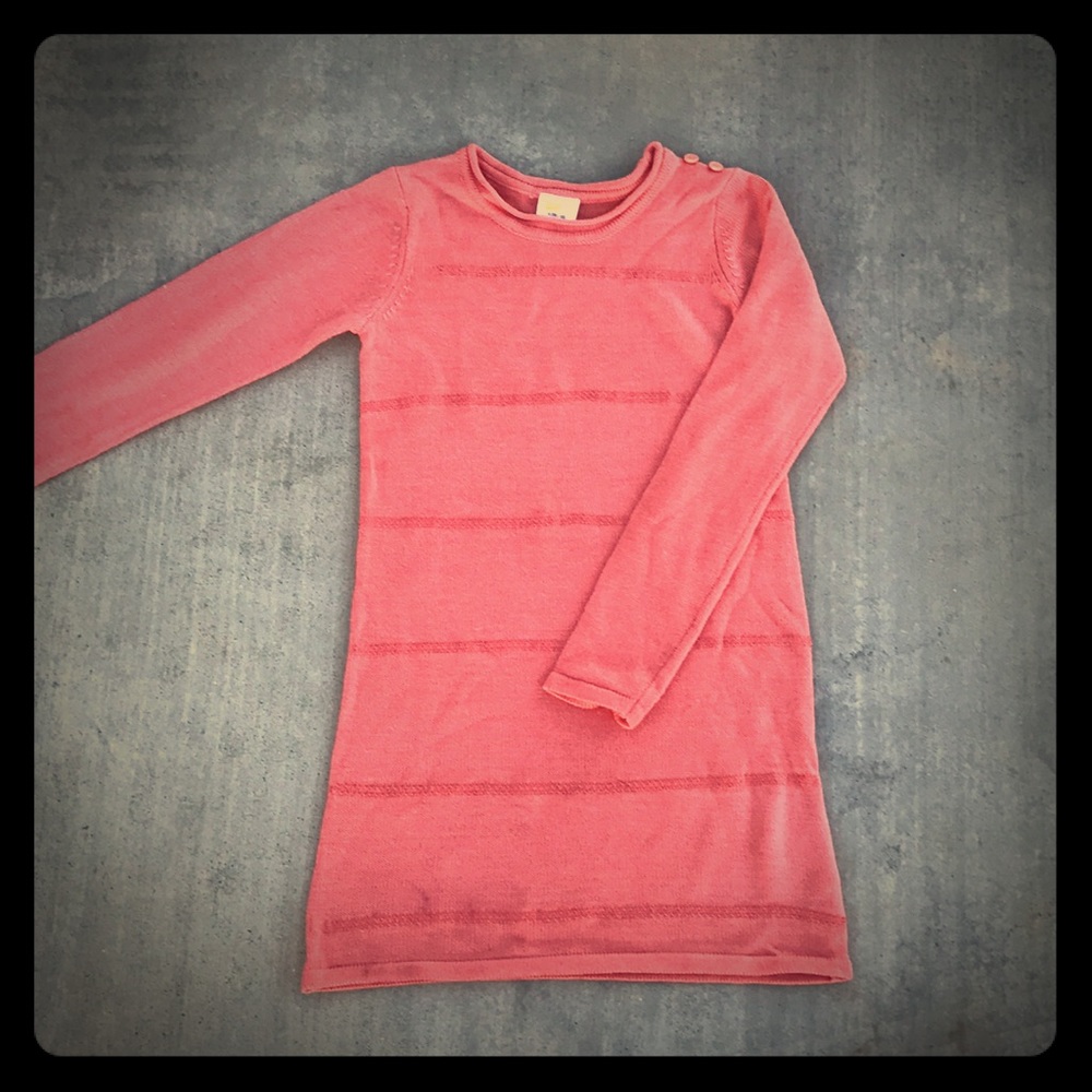 Girl's peach knit dress with sequins.